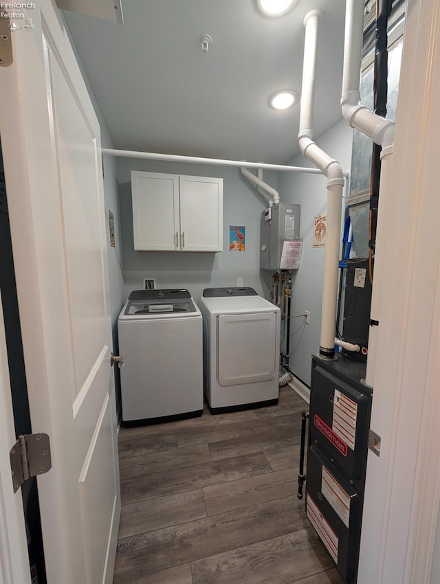 2620 S Waterside Ct Unit 622, Marblehead, OH 43440 - washroom featuring cabinet space, separate washer and dryer, and dark wood-style floors