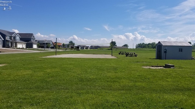2620 S Waterside Ct Unit 622, Marblehead, OH 43440 - view of green lawn with volleyball court, a residential view, and a shed