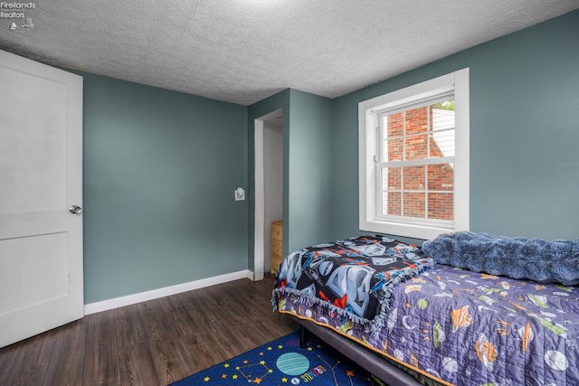 46320 Middle Ridge Rd, Amherst, OH 44001 - bedroom featuring wood finished floors and a textured ceiling