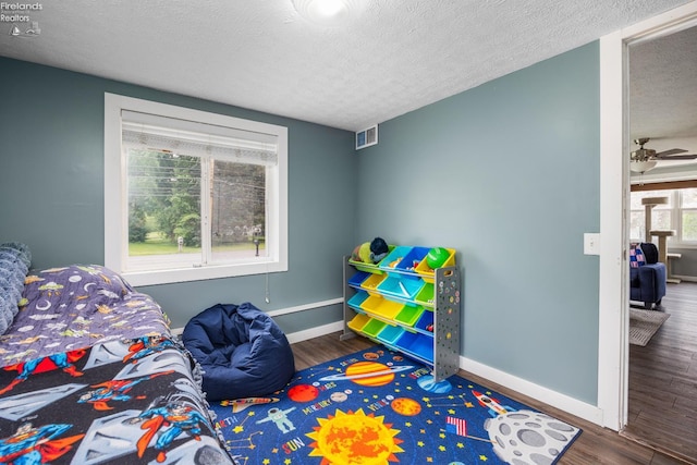 46320 Middle Ridge Rd, Amherst, OH 44001 - bedroom with wood finished floors and a textured ceiling