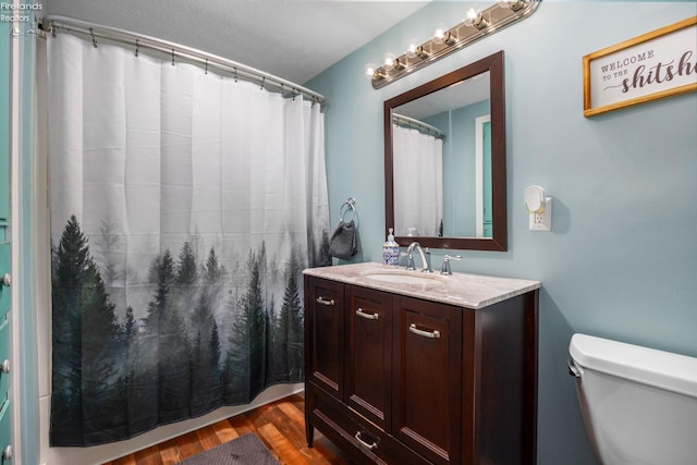 46320 Middle Ridge Rd, Amherst, OH 44001 - bathroom featuring vanity, wood finished floors, and a shower with shower curtain