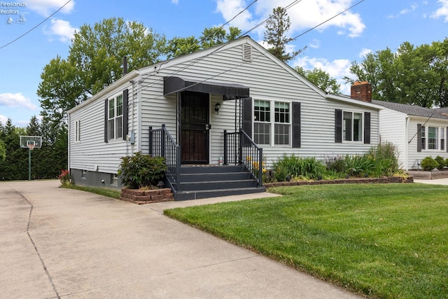 46320 Middle Ridge Rd, Amherst, OH 44001 - view of front of house with a front lawn and a chimney