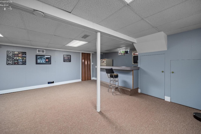 46320 Middle Ridge Rd, Amherst, OH 44001 - finished basement featuring a drop ceiling, freestanding refrigerator, carpet, and a dry bar
