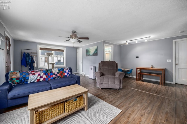 46320 Middle Ridge Rd, Amherst, OH 44001 - living area with ceiling fan, wood finished floors, and a textured ceiling