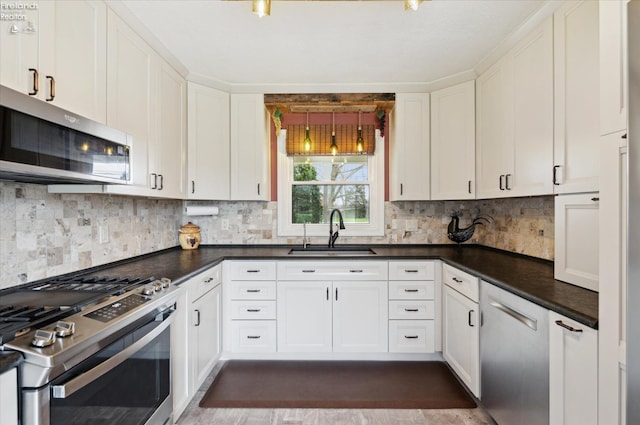 5191 N State Route 53, Tiffin, OH 44883 - kitchen with stainless steel appliances, white cabinetry, backsplash, and dark countertops
