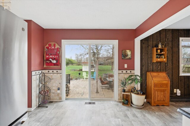 5191 N State Route 53, Tiffin, OH 44883 - entryway with wood finished floors and a baseboard heating unit