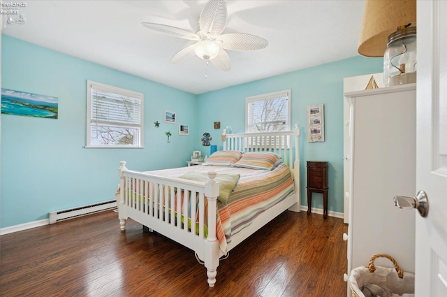 5191 N State Route 53, Tiffin, OH 44883 - bedroom with baseboard heating, wood finished floors, and a ceiling fan