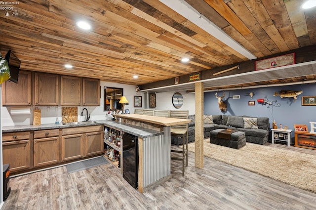 5191 N State Route 53, Tiffin, OH 44883 - kitchen with beverage cooler, a peninsula, open floor plan, wood finished floors, and wooden ceiling