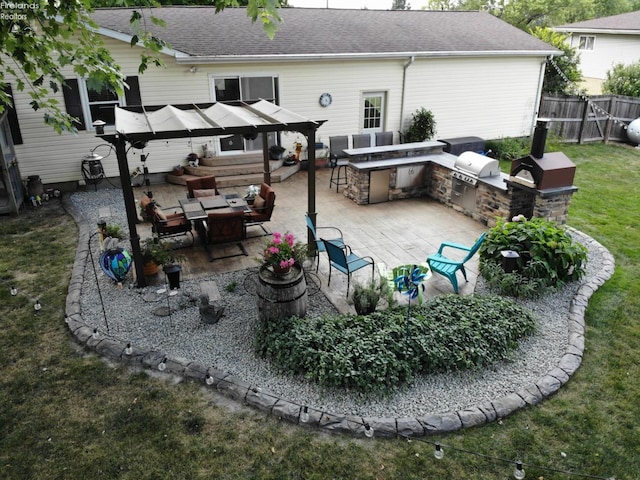 5191 N State Route 53, Tiffin, OH 44883 - rear view of house with area for grilling, roof with shingles, a patio, and a bar