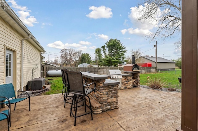 5191 N State Route 53, Tiffin, OH 44883 - fenced backyard with area for grilling and a wooden deck