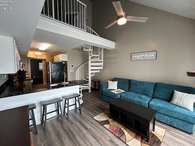 400 Swartz Ln Unit Y306, Middle Bass Island, OH 43446 - living area with dark wood-type flooring, stairs, high vaulted ceiling, and a ceiling fan