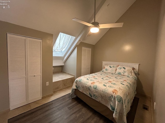 400 Swartz Ln Unit Y306, Middle Bass Island, OH 43446 - bedroom featuring vaulted ceiling, a skylight, multiple closets, wood finished floors, and a ceiling fan