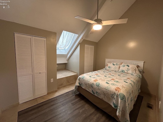 400 Swartz Ln Unit Y306, Middle Bass Island, OH 43446 - bedroom featuring lofted ceiling, a skylight, wood finished floors, ceiling fan, and multiple closets