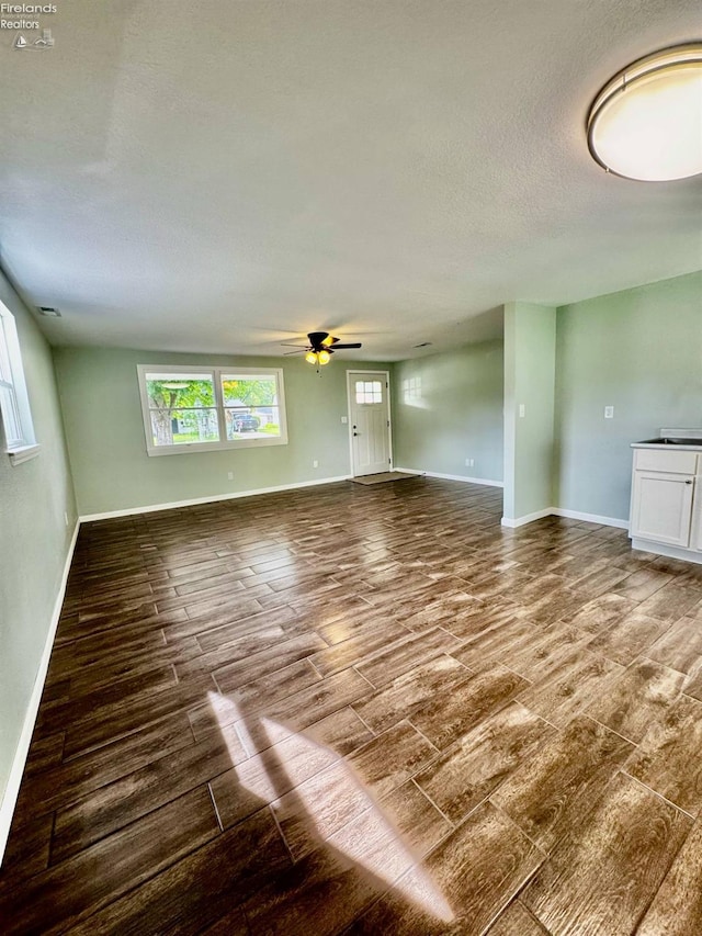 2150 Aspen Run, Sandusky, OH 44870 - unfurnished living room featuring wood finish floors, ceiling fan, and a textured ceiling