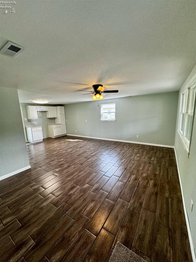 2150 Aspen Run, Sandusky, OH 44870 - unfurnished living room featuring wood finish floors, a textured ceiling, and ceiling fan