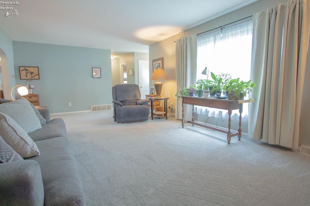 214 1st, Huron, OH 44839 - carpeted living room featuring arched walkways and baseboards