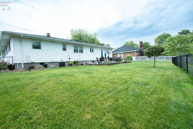 214 1st, Huron, OH 44839 - back of property featuring a fenced backyard and a chimney