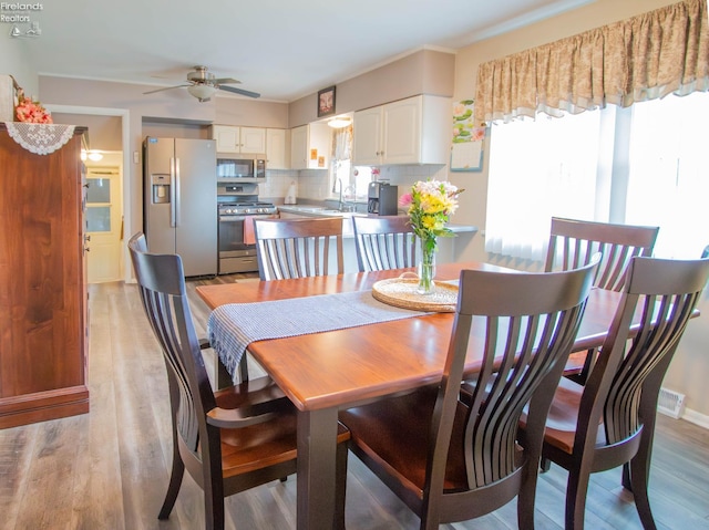 214 1st, Huron, OH 44839 - dining space featuring a ceiling fan and light wood-style flooring