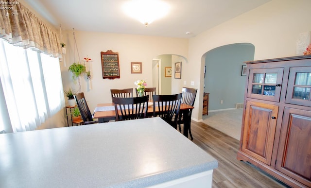 214 1st, Huron, OH 44839 - dining room with arched walkways and light wood-type flooring
