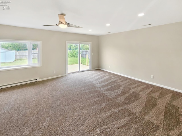 217 Ott St, Clyde, OH 43410 - carpeted empty room featuring ceiling fan, a baseboard radiator, and recessed lighting