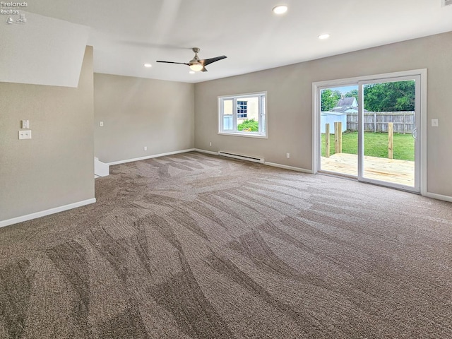 217 Ott St, Clyde, OH 43410 - empty room with a baseboard heating unit, carpet, a ceiling fan, and recessed lighting