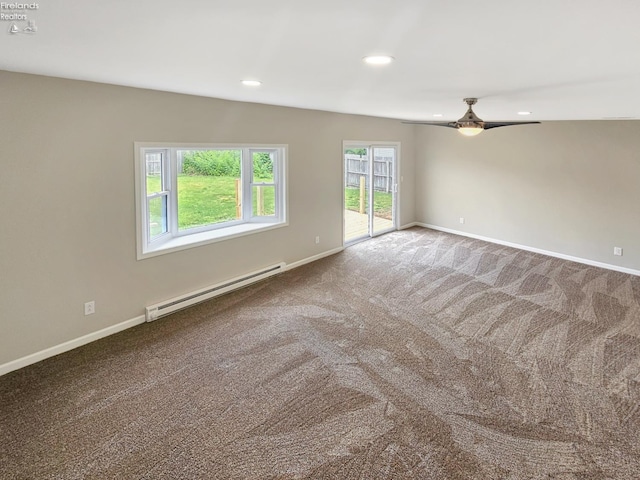 217 Ott St, Clyde, OH 43410 - carpeted empty room with a baseboard heating unit, ceiling fan, and recessed lighting