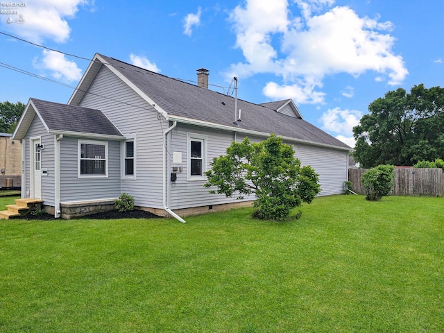 217 Ott St, Clyde, OH 43410 - back of property with a chimney and a shingled roof
