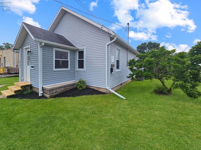 217 Ott St, Clyde, OH 43410 - view of side of home featuring a yard
