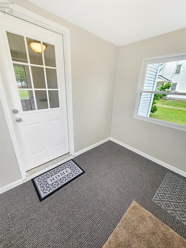 217 Ott St, Clyde, OH 43410 - doorway with carpet and baseboards