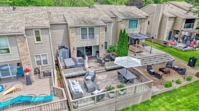 3616 Turfside Cir Unit B, Huron, OH 44839 - rear view of house with a deck, an outdoor hangout area, and brick siding