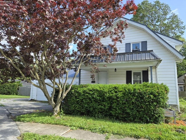 519 Howard St, Findlay, OH 45840 - view of front of house with asphalt driveway and a balcony