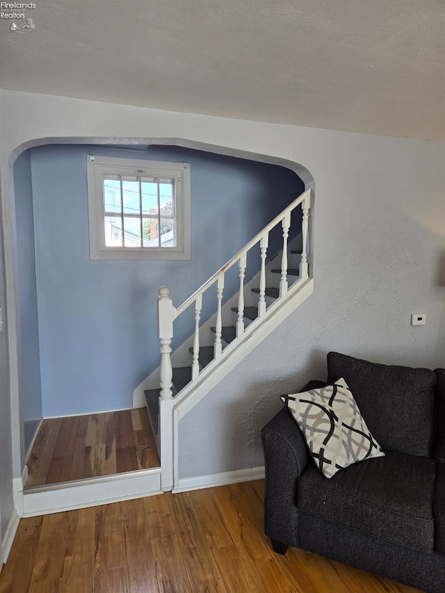 519 Howard St, Findlay, OH 45840 - stairs with wood finished floors and arched walkways