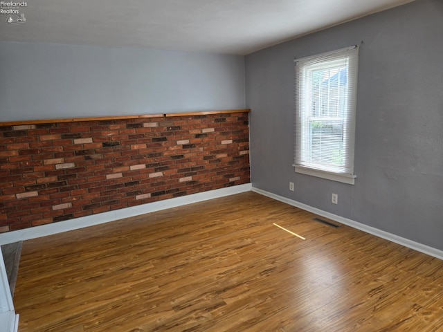 519 Howard St, Findlay, OH 45840 - empty room with wood finished floors and baseboards
