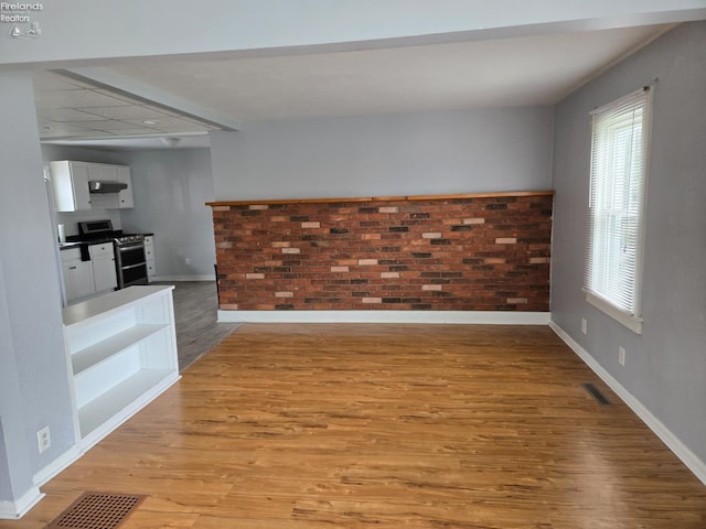 519 Howard St, Findlay, OH 45840 - unfurnished living room with light wood-style flooring and plenty of natural light