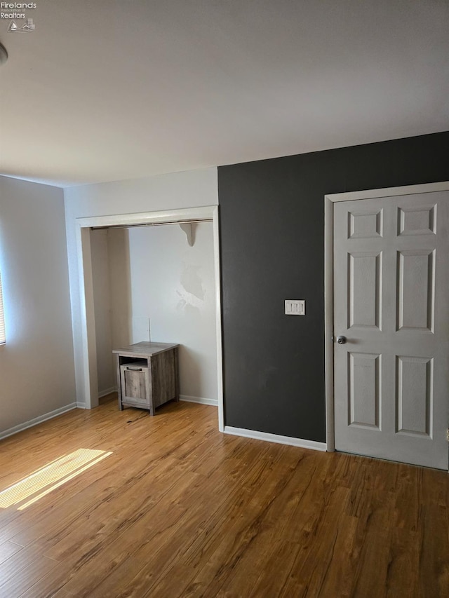 519 Howard St, Findlay, OH 45840 - unfurnished bedroom with wood finished floors and a closet
