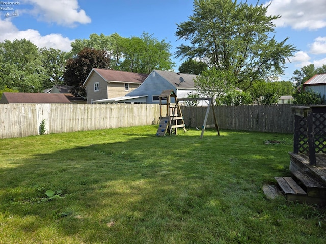 519 Howard St, Findlay, OH 45840 - fenced backyard featuring a playground