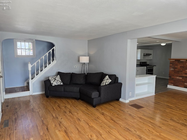 519 Howard St, Findlay, OH 45840 - living area featuring light wood-type flooring and stairs
