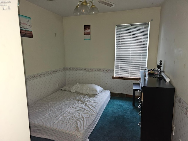 63 Williams Ave, Norwalk, OH 44857 - bedroom with carpet flooring, a wainscoted wall, an office area, wallpapered walls, and a ceiling fan