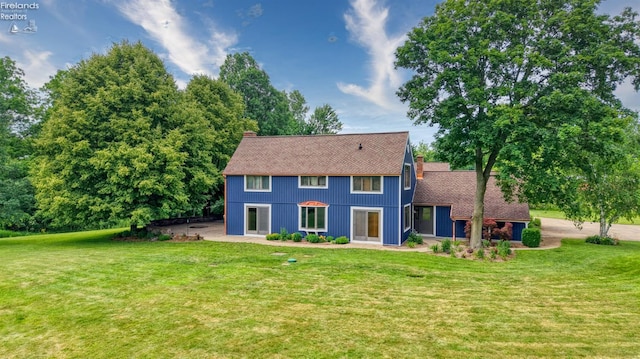 500 E State Route 61, Norwalk, OH 44857 - rear view of house featuring a chimney, a yard, and a shingled roof