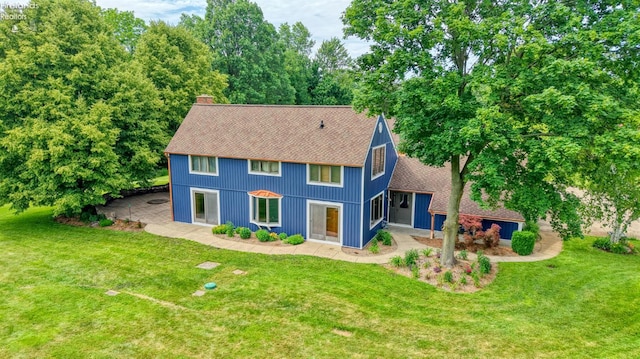 500 E State Route 61, Norwalk, OH 44857 - colonial inspired home with a chimney, a shingled roof, and a front lawn