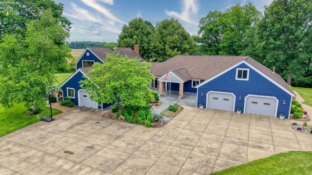 500 E State Route 61, Norwalk, OH 44857 - view of front facade with board and batten siding, view of scattered trees, a shingled roof, and concrete driveway