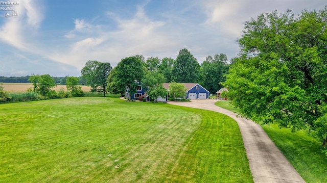 500 E State Route 61, Norwalk, OH 44857 - view of green lawn featuring concrete driveway and a garage
