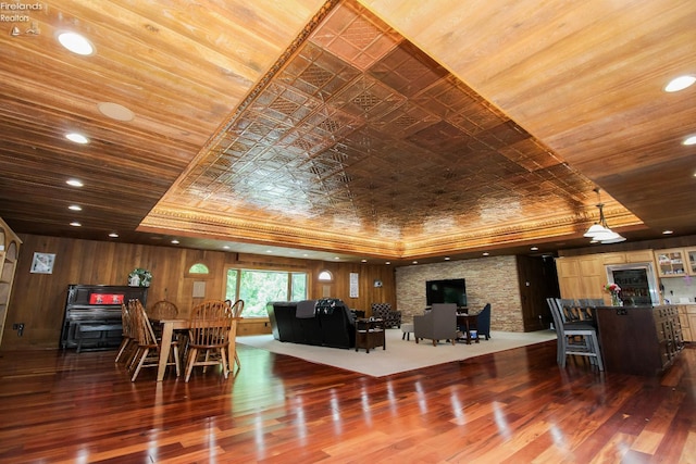 500 E State Route 61, Norwalk, OH 44857 - living room featuring wood finished floors, a raised ceiling, wood walls, and recessed lighting