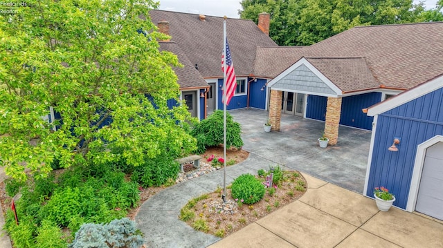 500 E State Route 61, Norwalk, OH 44857 - view of front of property with board and batten siding, a chimney, and roof with shingles