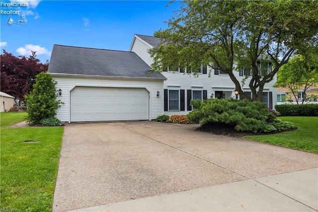 3813 Joti Ave, Huron, OH 44839 - colonial inspired home with a garage, a front yard, driveway, and a shingled roof