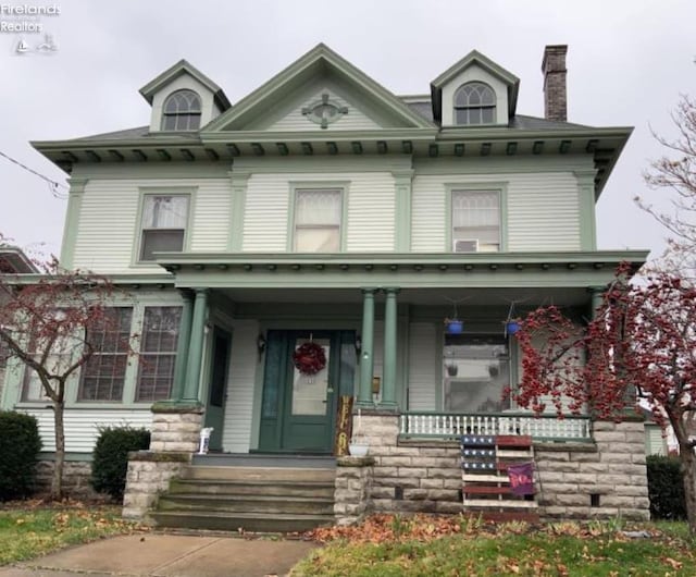 313 Lawrence St, Sandusky, OH 44870 - view of front of house with a porch and a chimney