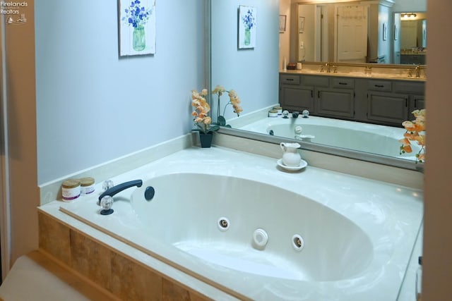 423 Leisure Dr, Huron, OH 44839 - full bathroom with a tub with jets and double vanity