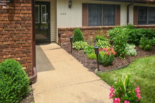 423 Leisure Dr, Huron, OH 44839 - doorway to property featuring brick siding