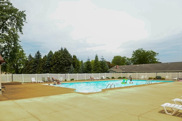 423 Leisure Dr, Huron, OH 44839 - community pool featuring a patio area