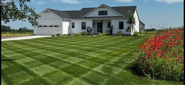 3508 Boos Rd, Huron, OH 44839 - modern farmhouse featuring driveway, a front yard, and a garage